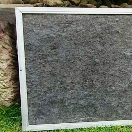 The same ducted filter after cleaning, with the dark filter mesh visible again